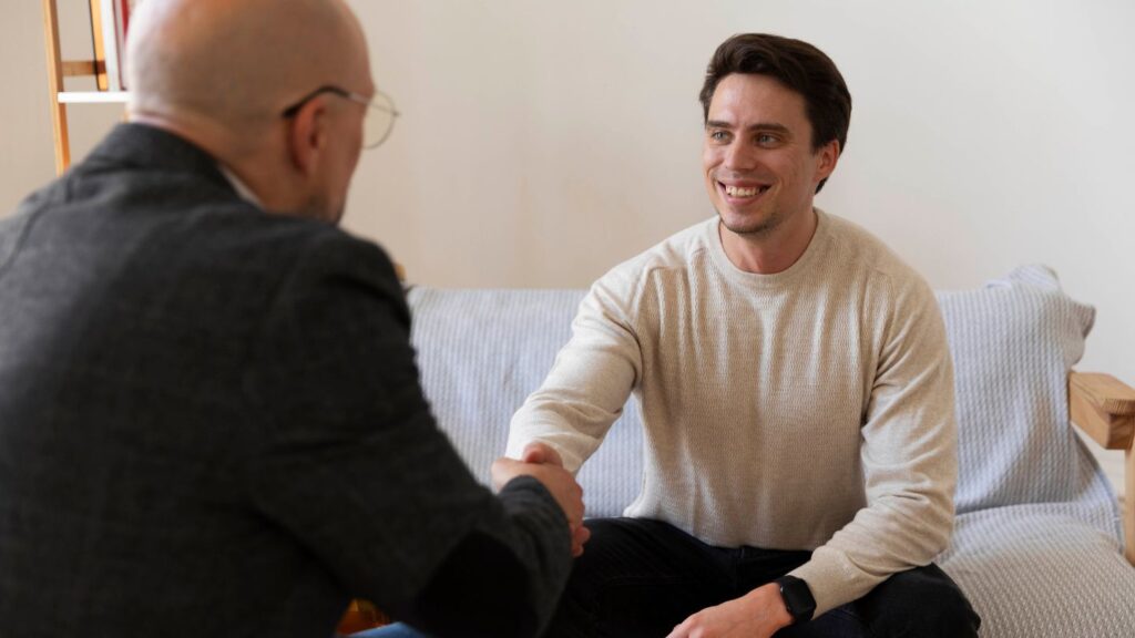 A man greeting his therapist at Mesa Oaks sober living program.